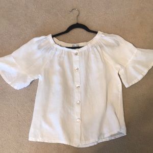 White shirt with flutter sleeves.